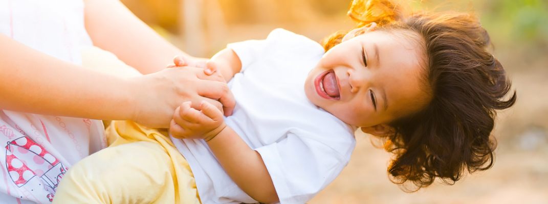 Happy child in golden sunlight.