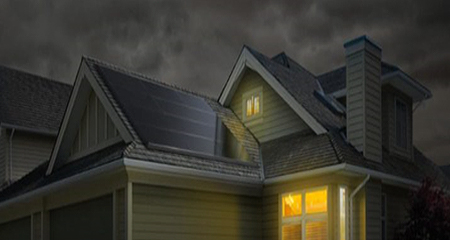 House with lights on in a storm