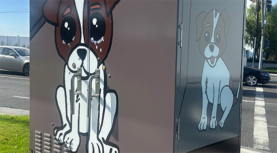 Utility box wrap of comic strip containg two humans and their pet dog.
